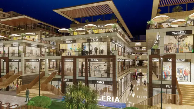 Artistic impression: atrium steps and shopfronts at night